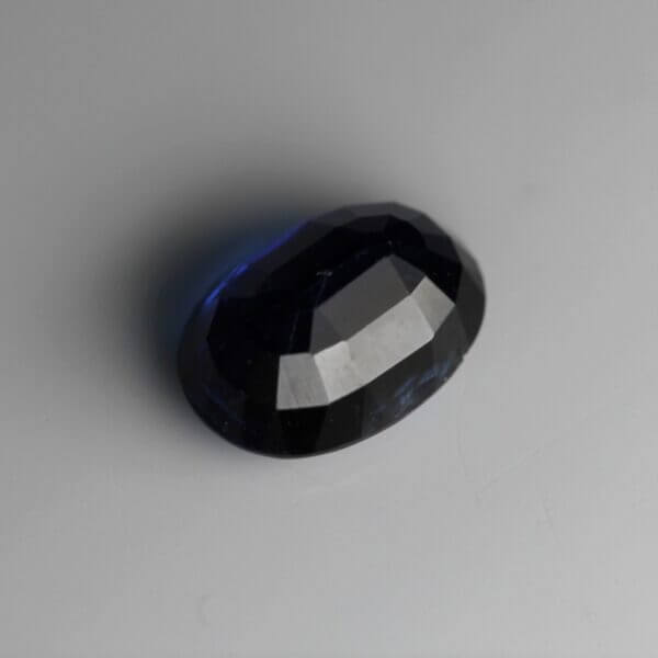 Kyanite, 7x5mm oval cut, back view.