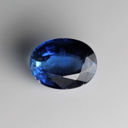 Kyanite, 8x6mm oval cut, front view.