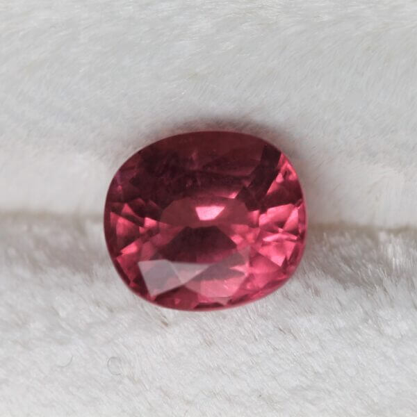 Mahenge Spinel, 7x6mm rounded oval cut, front view.