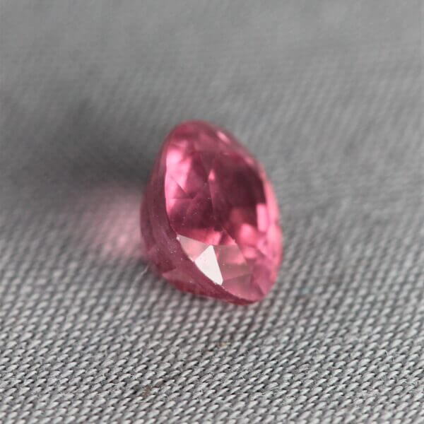 Mahenge Spinel, 7x6mm rounded oval cut, side view.
