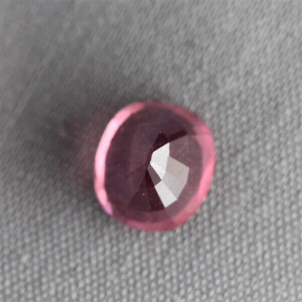Mahenge Spinel, 7x6mm rounded oval cut, back view.