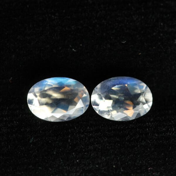 Moonstone, 7x5mm faceted oval cut matched pair, front view.