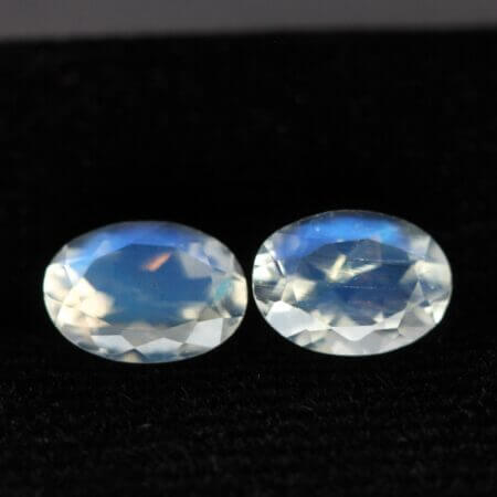 Moonstone, 7x5mm faceted oval cut matched pair, front view.