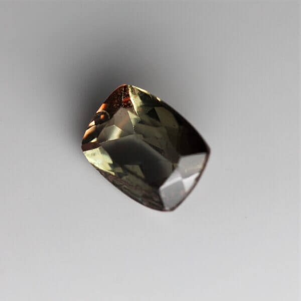 Andalusite, 8x6mm cushion cut, side view.