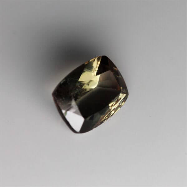 Andalusite, 8x6mm cushion cut, side view.