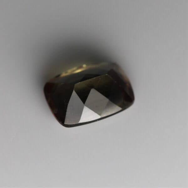 Andalusite, 8x6mm cushion cut, back view.