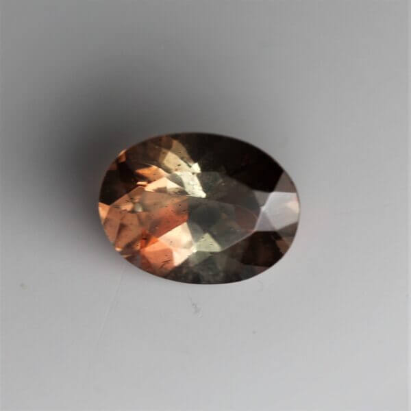 Andalusite, 8x6mm oval cut, front view.