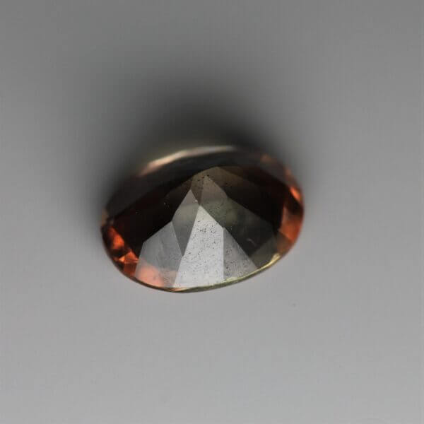 Andalusite, 8x6mm oval cut, back view.