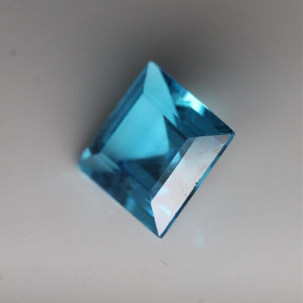Swiss Blue Topaz, 10mm square cut, side view.