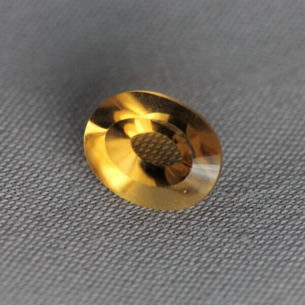 Madeira Citrine, 8x6mm concentric round cut, side view.