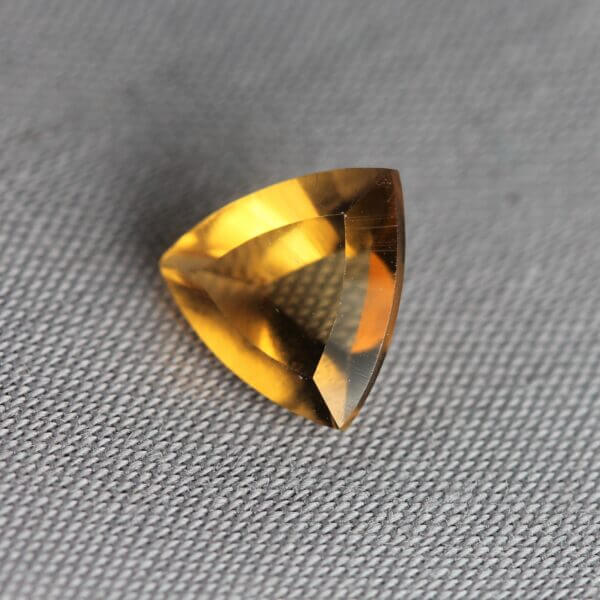 Madeira Citrine, 7mm concentric trillion cut, side view.