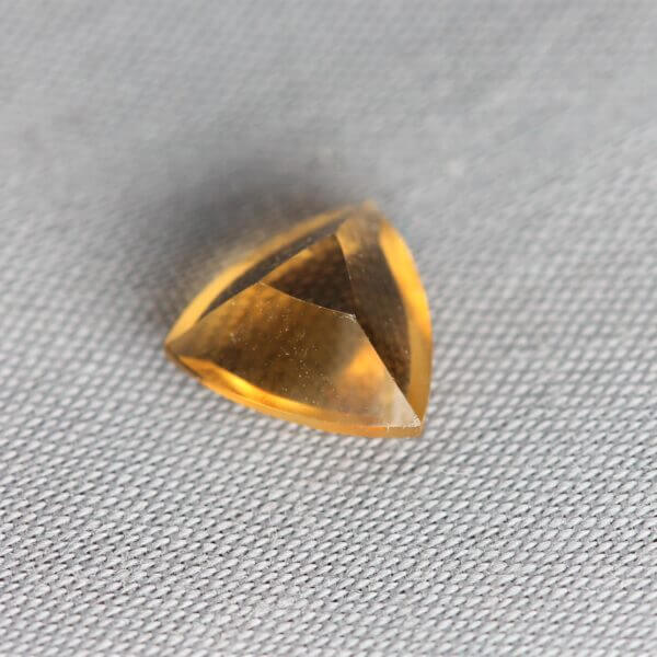 Madeira Citrine, 7mm concentric trillion cut, back view.
