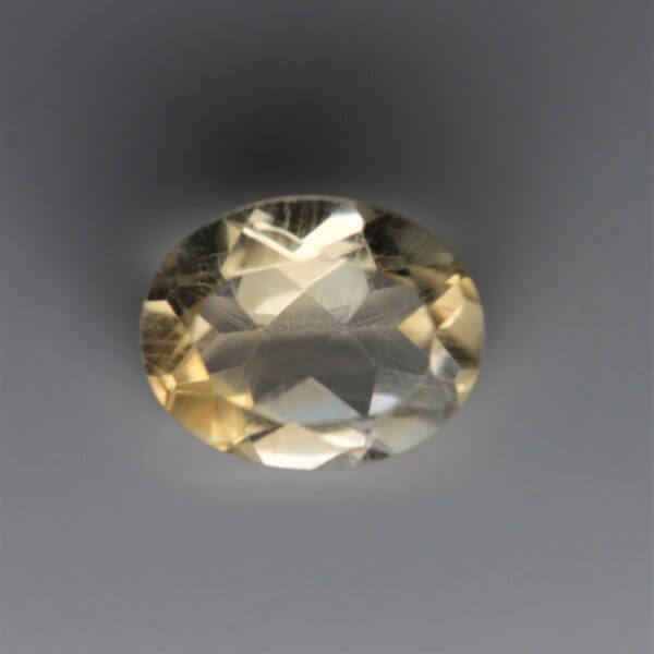 Citrine, 10x8mm oval cut, front view.