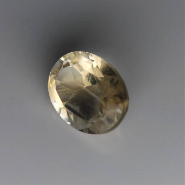 Citrine, 10x8mm oval cut, side view.