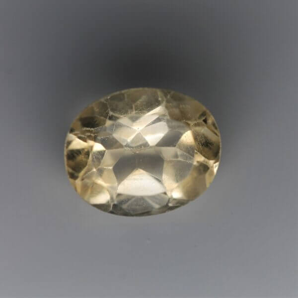 Citrine, 11x9mm oval cut, front view.