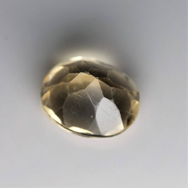 Citrine, 11x9mm oval cut, back view.