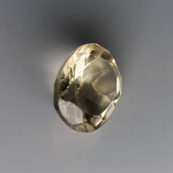 Citrine, 11x9mm oval cut, side view.