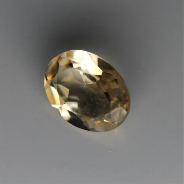 Citrine, 8x6mm oval cut, side view.