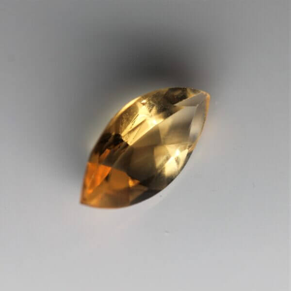 Citrine, 12x6mm marquise cut, side view.