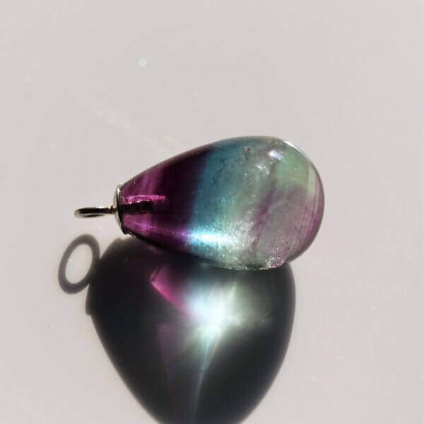 Fluorite, 15x10mm briolette bead, with ring.
