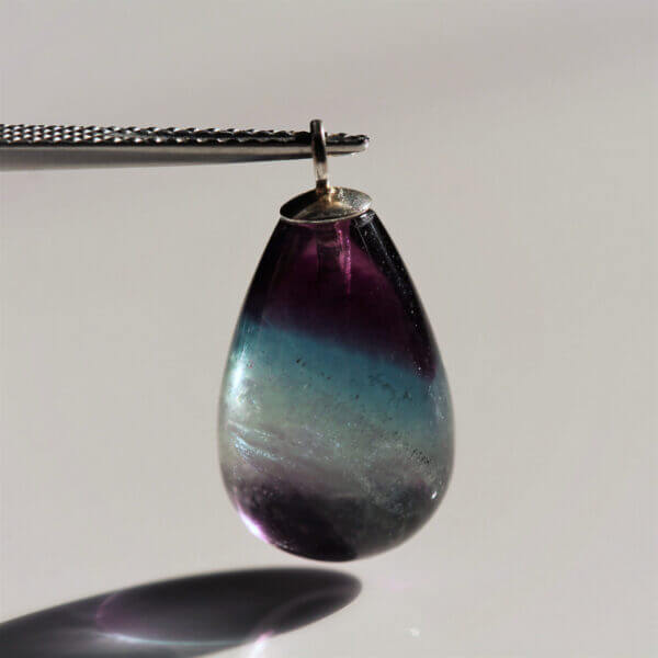Fluorite, 15x10mm briolette bead, with ring.