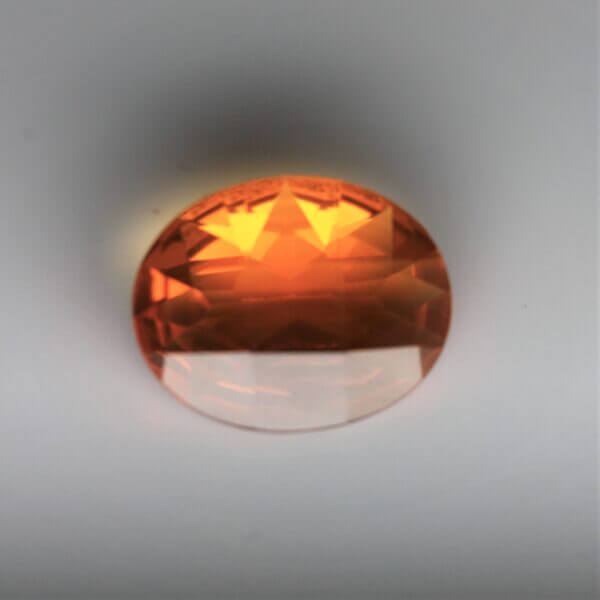 Mexican Fire Opal, 10x8mm oval cut, front view.