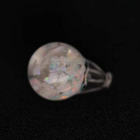 Opal suspended in a 8mm round globe, front view.
