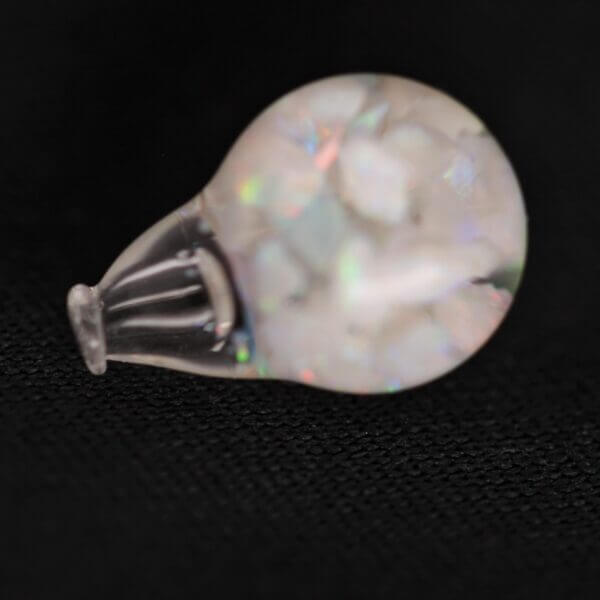 Opal suspended in a 8mm round globe, detail shot.