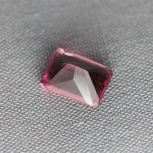 Pink Spinel, 7x5mm octagon cut, back view.