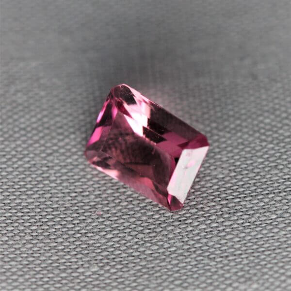 Pink Spinel, 7x5mm octagon cut, side view.